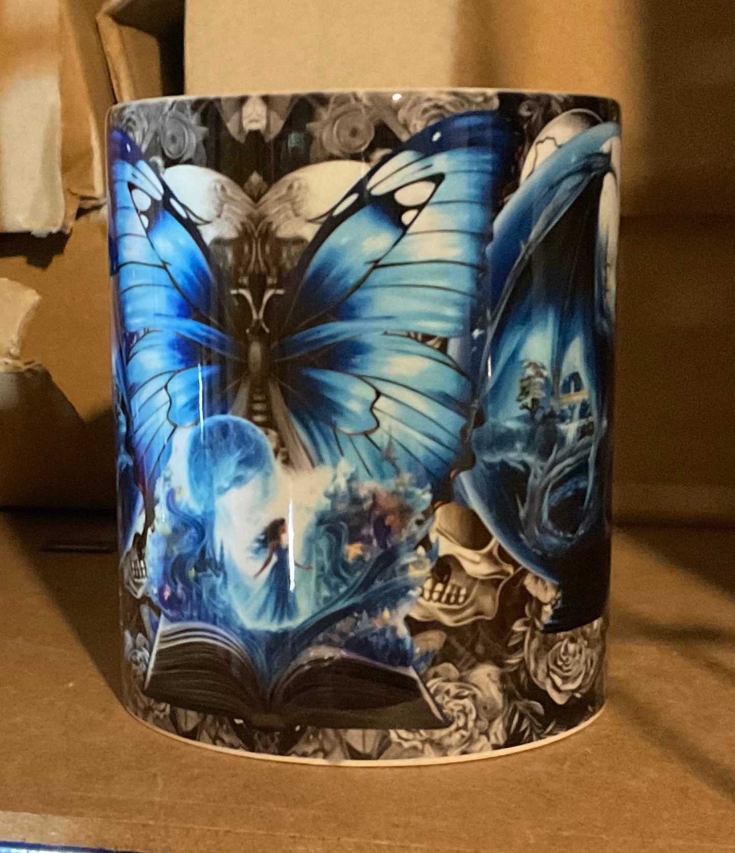 Mythical blue dragon on grey skulls full wrap fairytale mug