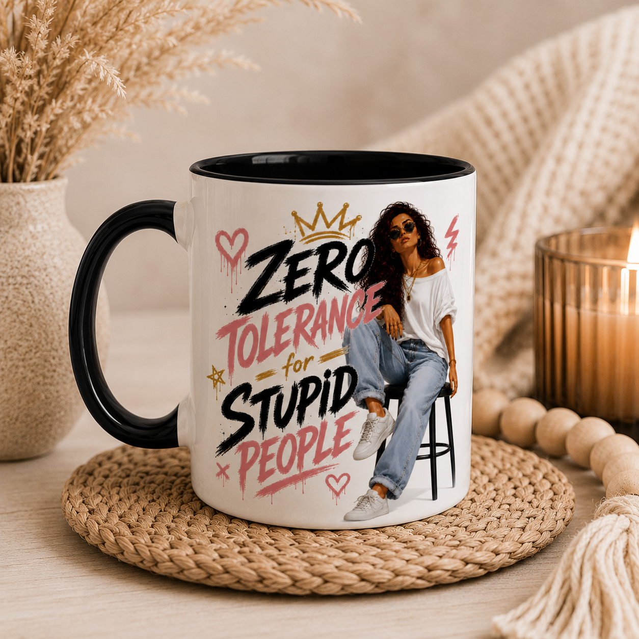 11oz white ceramic sarcastic mug with black inside and handle featuring the quote "Zero Tolerance For Stupid People" with trendy illustrated woman artwork displayed in a cosy home setting. Funny coffee mug for women and novelty mug ideal as a best friend gift, work colleague gift, office gift, birthday present and funny gift for women who appreciate coffee and sarcasm.