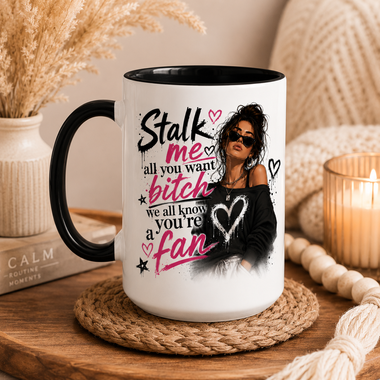 15oz large white ceramic mug with black inside and handle featuring the quote "I Would Listen But You Bore The F*ck Out Of Me" alongside a stylish fashion inspired woman illustration displayed in a cosy modern boho home setting. Large coffee mug and big tea mug perfect for women with a sarcastic sense of humour and love of statement mugs with attitude. Funny mug for her, rude coffee mug, novelty mug, best friend gift, sister gift, coworker gift, work bestie gift, birthday gift for women and Secret Santa gif