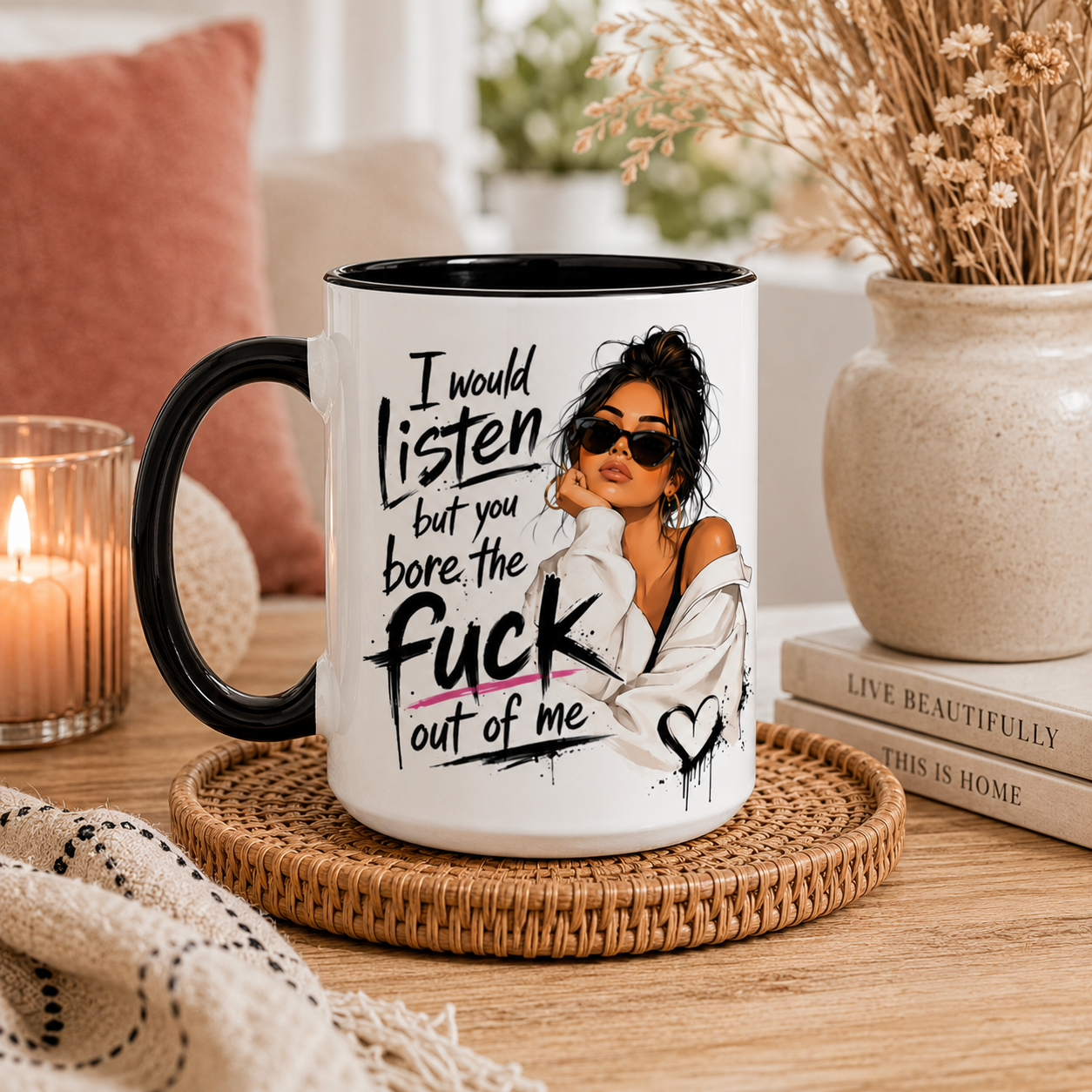 15oz white ceramic mug with black inside and handle featuring the funny quote “I Would Listen But You Bore The Fuck Out Of Me” alongside a stylish illustrated woman design. Displayed in a cosy modern boho setting with neutral décor and soft lighting. Larger 15oz funny sarcastic mug for women, rude coffee mug, novelty gift, best friend gift, coworker present, sister gift and cheeky birthday present. Design printed on both sides with optional name personalisation and subtle Pypog logo on side.