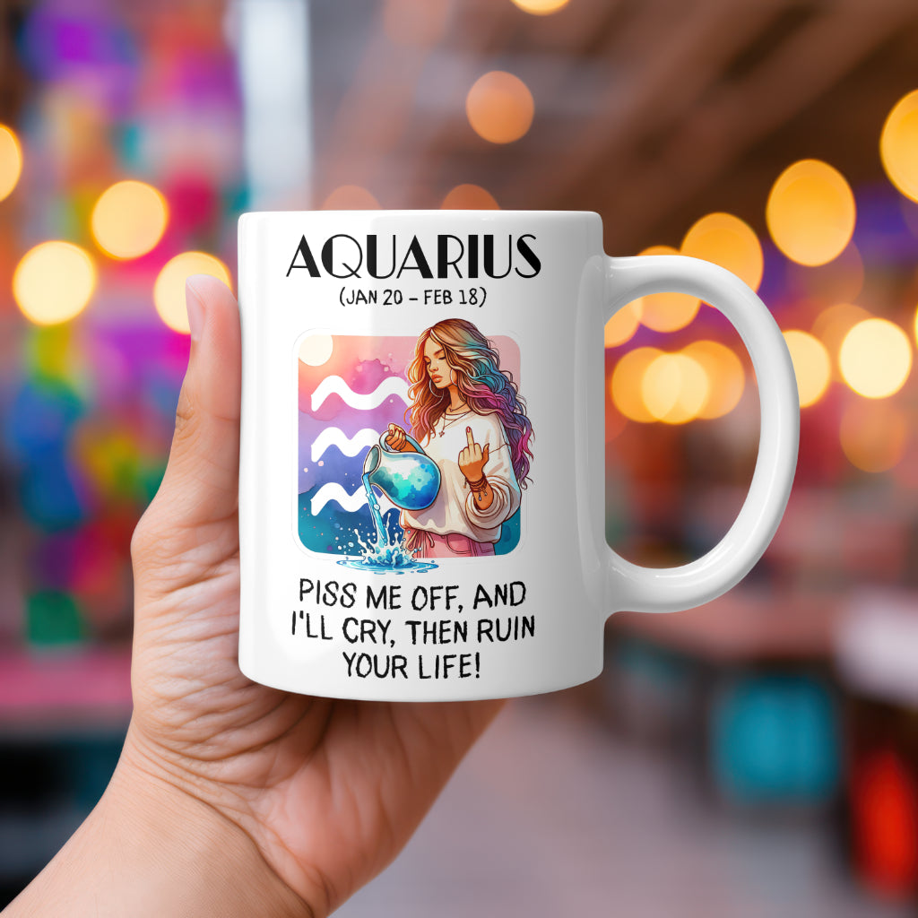A white 11oz coffee mug featuring a bold Aquarius-themed design. The artwork showcases a woman with wavy pastel hair, pouring water from a jug while flipping the middle finger, set against a vibrant Aquarius zodiac symbol. Below, the sassy text reads: "Piss me off, and I’ll cry, then ruin your life!" A cheeky, rude astrology gift for Aquarius star sign lovers.
