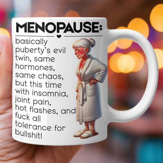 Mug with humorous illustration of an older woman and text about menopause.