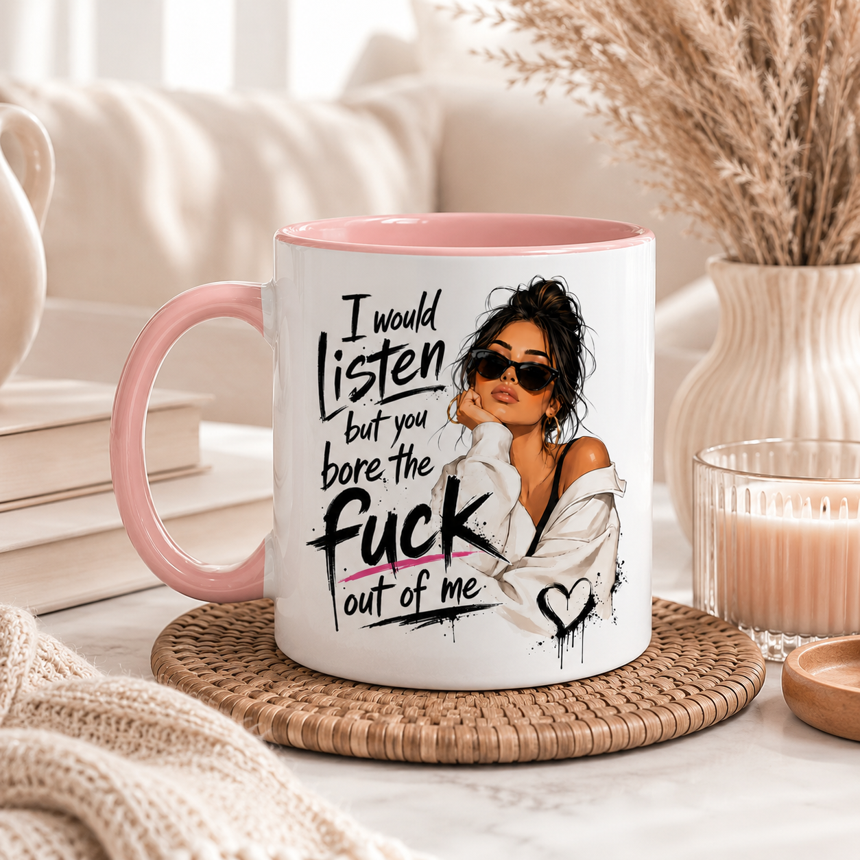 White 11oz ceramic mug with pink inside and handle featuring the funny quote “I Would Listen But You Bore The Fuck Out Of Me” alongside a stylish illustrated woman design. Displayed in a cosy boho home setting with neutral décor and candles. Funny sarcastic mug for women, rude coffee mug, novelty mug, best friend gift, sister gift, coworker present and cheeky birthday gift idea printed in the UK.