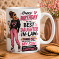 White mug with a design and text for a daughter-in-law on a wooden tray with cookies and flowers.