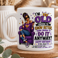 Mug with a design of a woman in a purple chair, text, and a glass of wine on a wooden coaster.