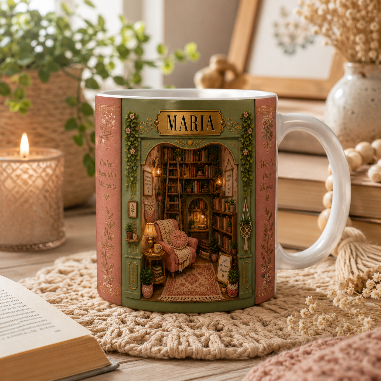 Decorative mug with a miniature scene and 'Maria' on it, placed on a textured surface with books and plants in the background.