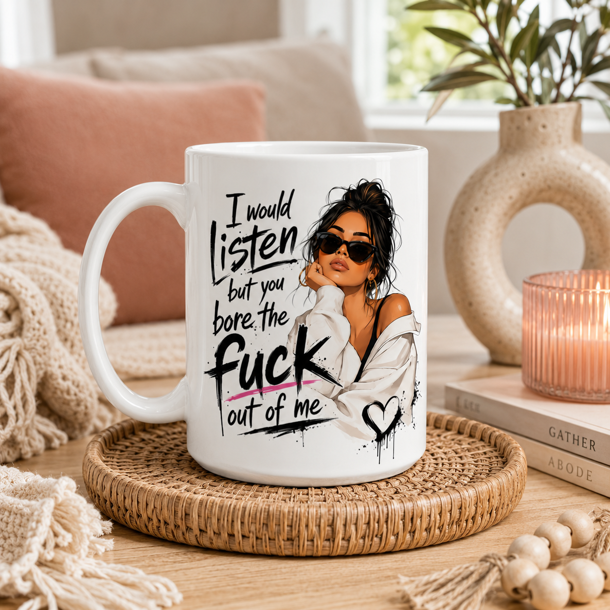White big 15oz ceramic mug with black inside and handle featuring the quote “I Would Listen But You Bore The Fuck Out Of Me” and fashionable woman artwork. Styled in a modern boho home setting with warm décor. Funny mug for her, sarcastic coffee mug, novelty gift, rude mug, best friend present, work bestie gift and funny birthday gift for women.